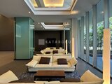 グランドシティタワー月島 間接照明が落ち着いた印象を与えるモダンなラウンジスペース