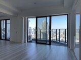 グランドシティタワー月島 高層階からの都市風景を望む開放的なリビングダイニング