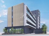 レックスガーデン神楽坂北町 モダンな外観デザインの建物を青空から見上げた様子