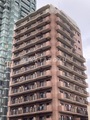 アルブル高輪 レンガ調ファサードと共用バルコニーが特徴的な建物外観