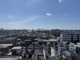 RJRプレシア蒲田 高層階からの開放的な眺望、遠くの街並みが広がる景色