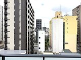 ジーグランデ三ノ輪 高層階からの眺望で、周辺の建物群が広がる開放的な景観