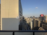 ダフィット錦糸町 高層階からの街並みと隣接建物を望むバルコニーからの眺望