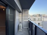 プラウドフラット西蒲田 開放的なバルコニーから都市景観を望む様子