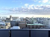 プラウドフラット西蒲田 バルコニーから望む街並みと開放的な都市景観
