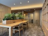ルフォンプログレ赤羽マークス 木調の間仕切りとグリーンで落ち着いた雰囲気のコミュニティスペ