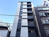 東麻布平成レジデンス モダンな印象の白黒タイルを組み合わせた建物外観