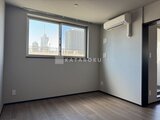 グランジット月島TOKYO BAY 都市の眺望が見える大きな窓のある明るい洋室
