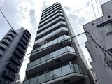 エスレジデンス入谷アレシア モダンな外観のマンション建物を下から見上げた様子