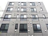 Aglaia 千石 Deux グレーのタイル張りでシンプルにまとめた建物外観