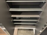Aglaia 千石 Deux 階段上部から見た段々の天井と照明が印象的な階段室の様子