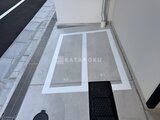 アーバネックス錦糸公園3 駐車スペースの番号表示と整理された共用通路の様子