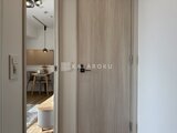 クレヴィアリグゼ蒲田西 玄関から洋室を見通した落ち着きのある廊下空間