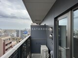 クレヴィアリグゼ蒲田西 洗濯機置き場と街並みが見渡せるバルコニーの様子