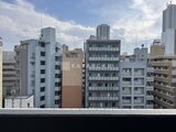 アークマーク大塚 周辺の低層マンション群と高層ビルが見える都市景観