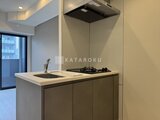 アークマーク大塚 モダンなキッチンカウンターとガスコンロ、シンクが一体となった
