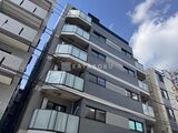 エスレジデンス亀戸バーム 街路から見たモダンなデザインの建物外観