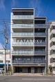 ルフォンリヴェント板橋西台 青空を背景にした、モダンなデザインのビル外観と街並み