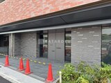リテラス南千住サウス モダンな外観のエントランス周りにグレーのタイル張りを配した前