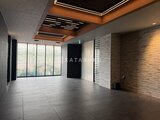 リテラス南千住サウス モダンな照明と落ち着いた色調の共用ロビー空間