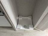 リテラス南千住サウス 洗面台と洗濯機が収まる明るい洗面脱衣室