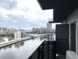 エスレジデンス千住大橋ブロード 河川沿いの開放的なバルコニーから望む都市風景