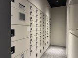 ES-Grande錦糸町ザ・クラス 整理されたデザインの宅配ボックスが並ぶ共用部