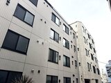 ES-Grande門前仲町デュオ 白いタイル張りの落ち着いた印象の建物外観
