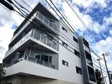 ブランシエスタ品川大井町パークエッジ モダンデザインの4階建て建物を下から見上げた外観