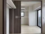 デュオフラッツ浅草田原町ネスト 開放的なリビングダイニングと繋がるモダンな玄関スペース