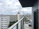 アーバネックス住吉 バルコニーから見た都市景観と晴天下の街並み