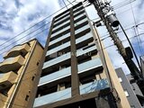 デュオメゾン品川戸越 前面道路から見た落ち着いたレンガ調の建物外観