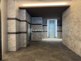 デュオメゾン品川戸越 モダンな石貼りタイルで統一された共用ホールの通路