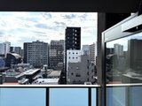 デュオメゾン品川戸越 バルコニーから見た都市景観と周辺の建物群