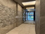 アーバンパーク日暮里2 モダンなタイル貼りのエントランスホール