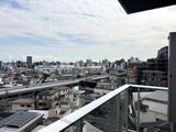 ドゥーエ曳舟3 開放的なバルコニーから見た街並みと空の景観