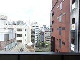 コンフォリア・リヴ茅場町 窓から見た都市の街並みと青空が広がる眺望