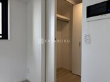 リージア代々木ビナリオ 開放的なキッチンと洋室を繋ぐ廊下スペース