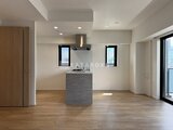 リージア代々木ビナリオ 開放的なリビングダイニングと島型キッチンの一体空間