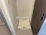 パークアクシス五反田スカイタワー 洗濯機パンと落ち着いた色合いの玄関ホール