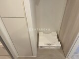 パークアクシス五反田スカイタワー 洗濯機置き場を備えた落ち着いた印象のユーティリティスペース