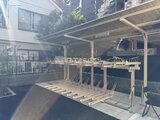 エスレジデンス住吉アクアハト 日差し降り注ぐテラス空間と開放的なパーゴラが備わった外観