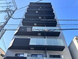 エスレジデンス住吉アクアハト 青空を背景にした建物の正面外観
