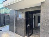 エルファーロ目黒3 グレー系タイルの落ち着いた印象のエントランス外観