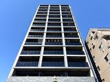 ラグゼナ船堀 下から見上げた現代的なマンション外観と青空
