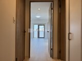 グランカーサ上野松が谷 廊下から見たリビングダイニングへの開放的な空間