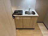 グランパセオ押上八広 木目調のキャビネットにガスコンロと