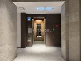 スタイリオ池上サウス エレベーターホール付きの落ち着いた共用廊下