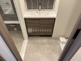 スタイリオ池上サウス 落ち着いた色合いの洗面化粧台と清潔感のある洗面室