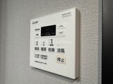 エクサム赤坂 浴室暖房乾燥機の操作パネルが取り付けられた壁面